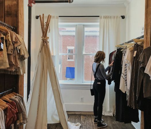 Young woman shopping at a downtown trendy boutique