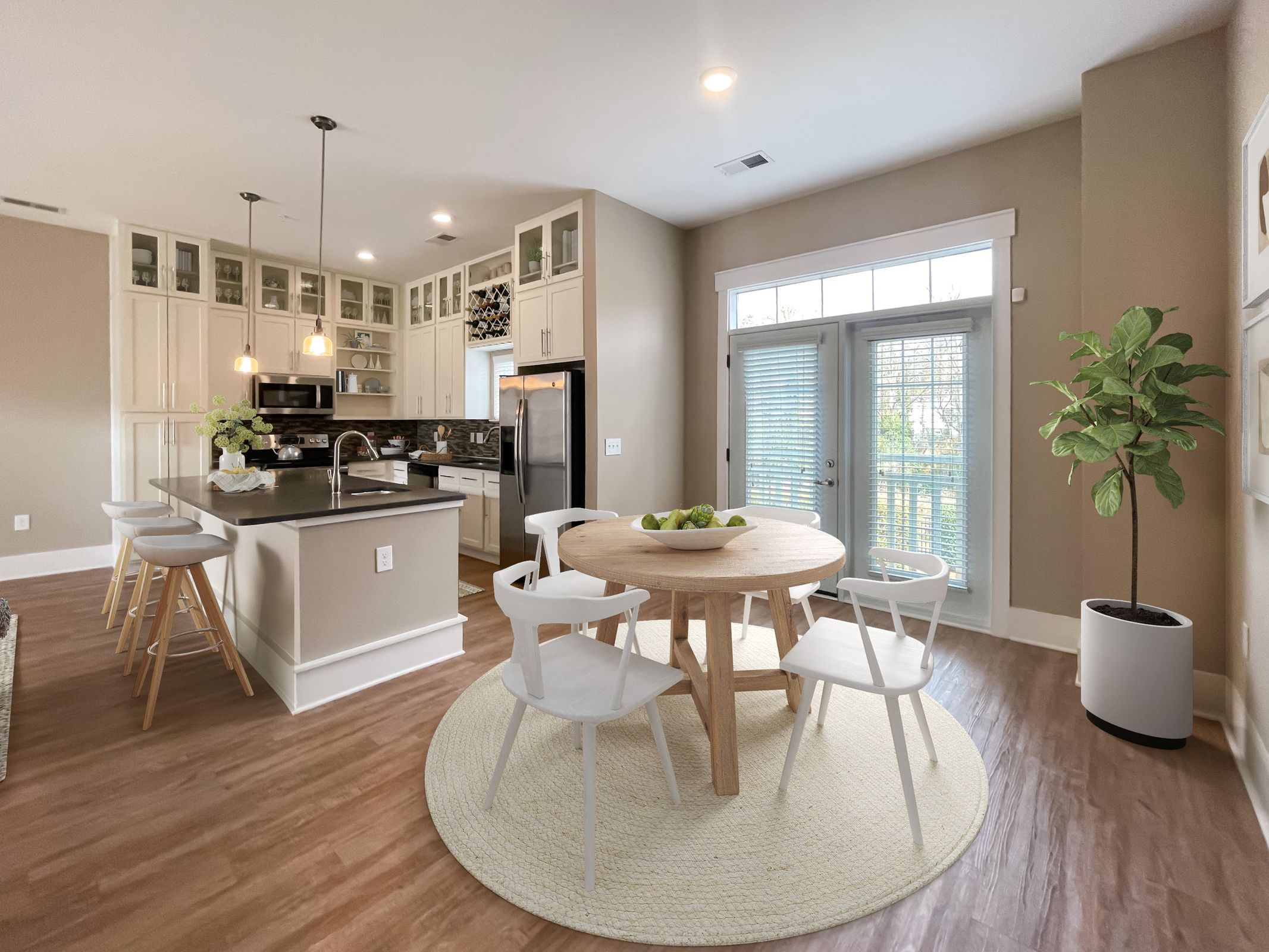 The Village at Commonwealth apartment dining room and kitchen area with modern farmhouse style furnishings