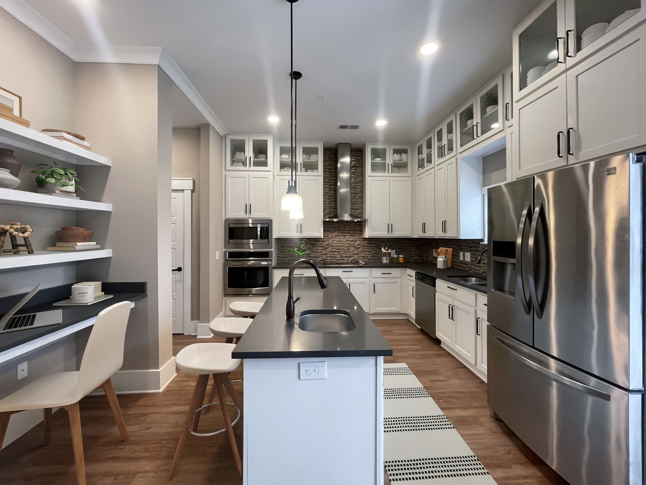 The Village at Commonwealth apartment monochromatic style kitchen with large kitchen island