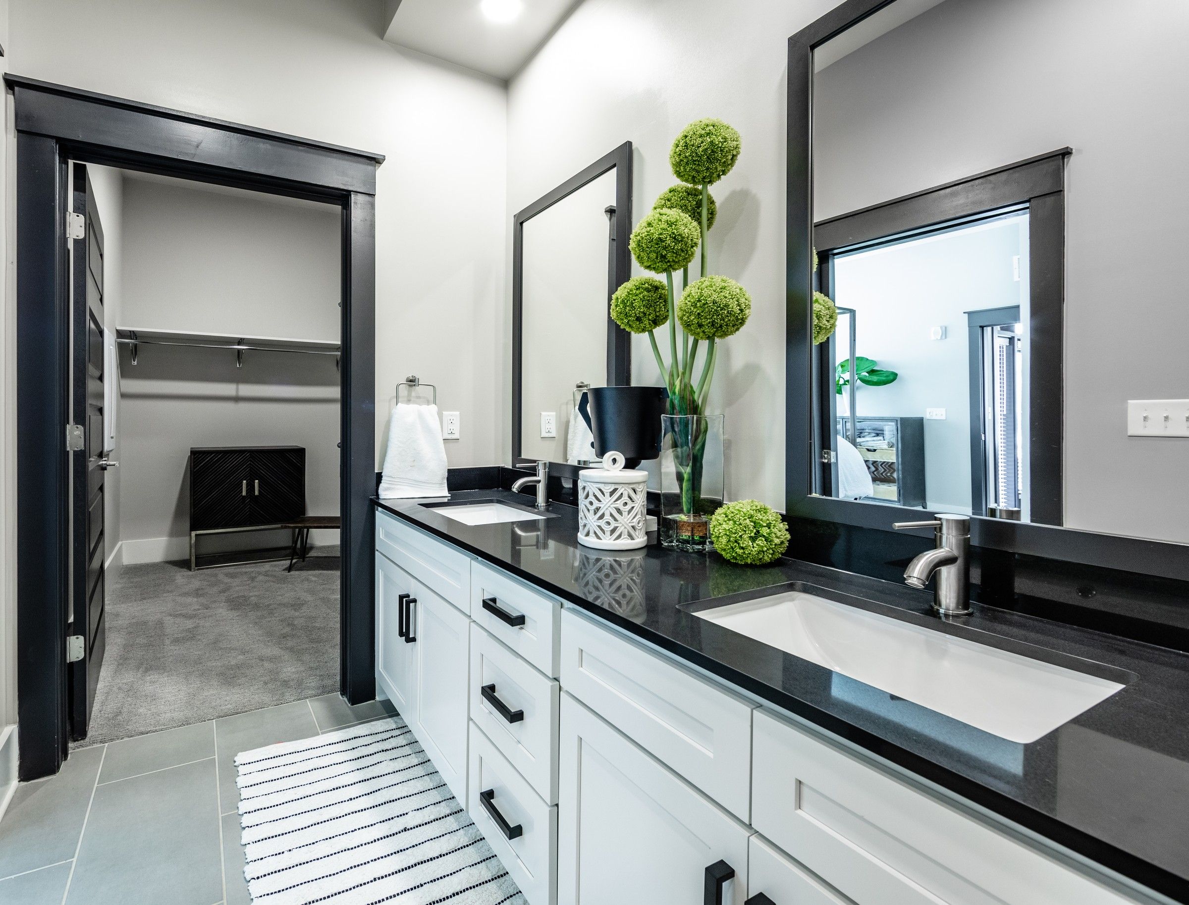 The Village at Commonwealth apartment modern style bathroom with double vanity and walk in closet