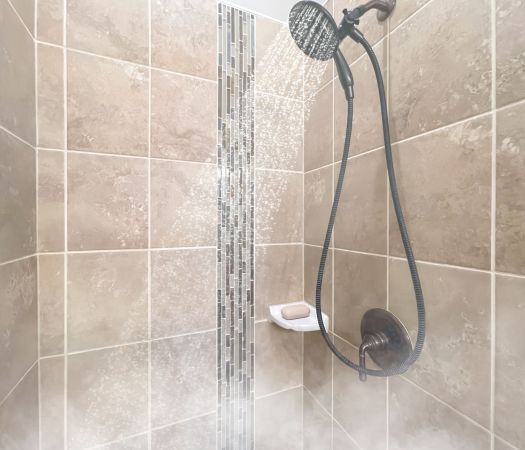 The Village at Commonwealth apartment rain shower with decorative tile walls