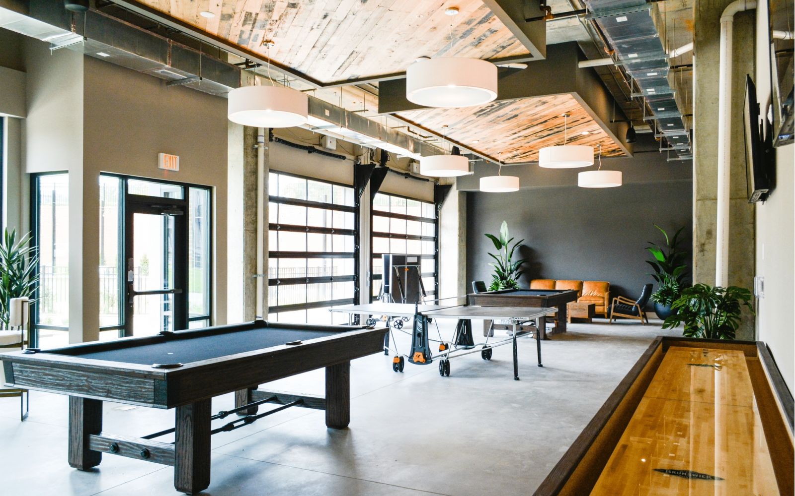 The Village at Commonwealth apartments game room lounge with billiards.