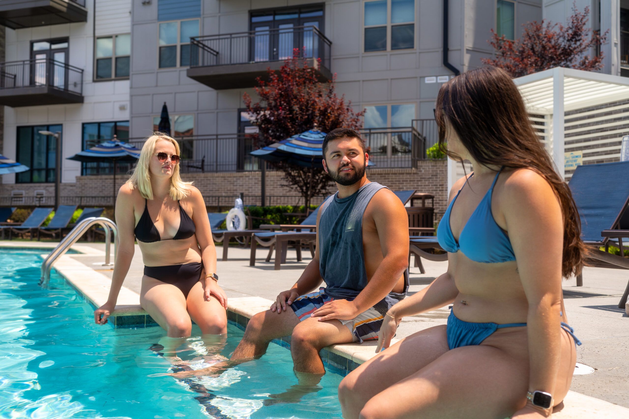 The Village at Commonwealth resort-style luxury outdoor pool and spa with surrounding lounge seating