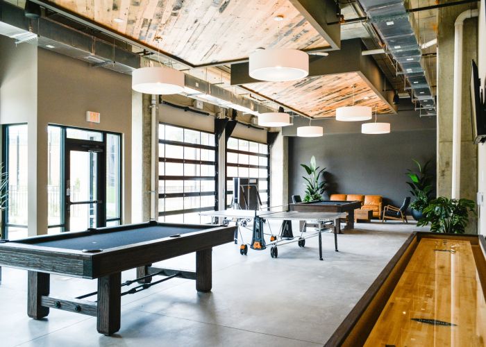 The Village at Commonwealth apartments game room lounge with billiards.