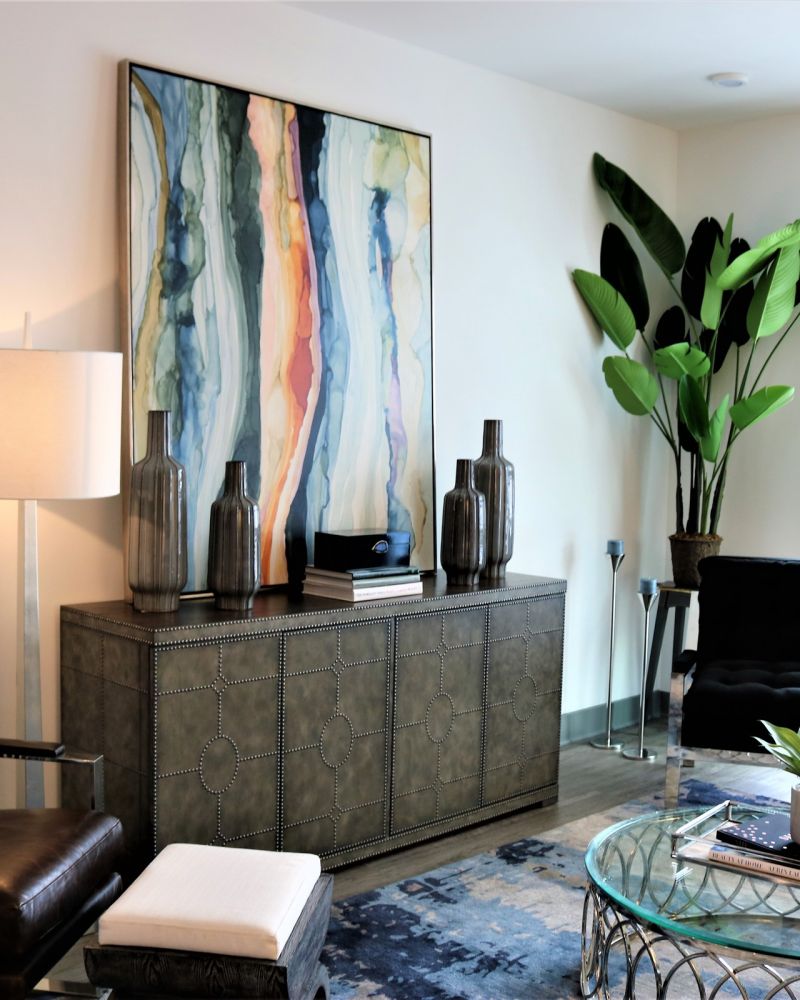 The Village at Commonwealth spacious living room and kitchen with large windows and modern furnishings