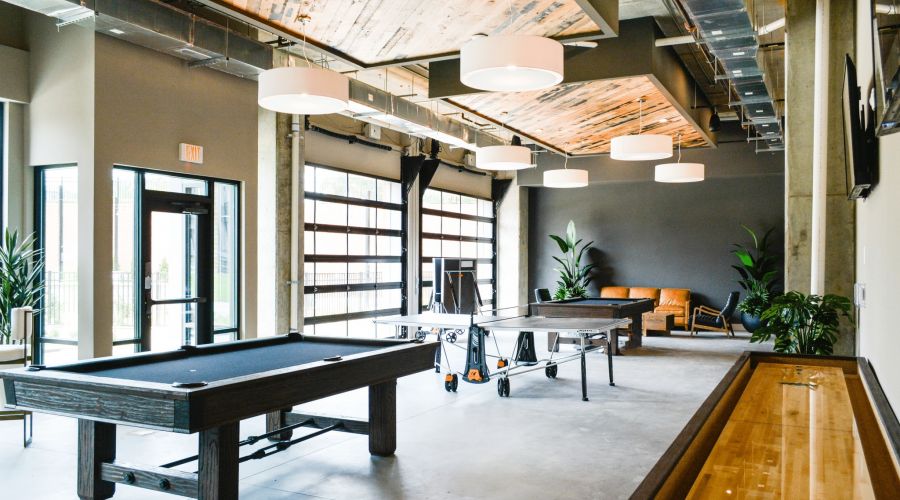 The Village at Commonwealth apartments game room lounge with billiards.